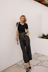 a lady in a all-black look